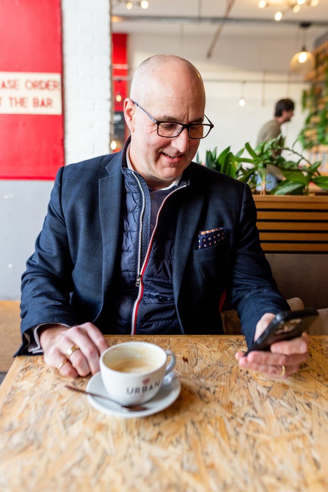 B.D. Dalton relaxing in a café with coffee