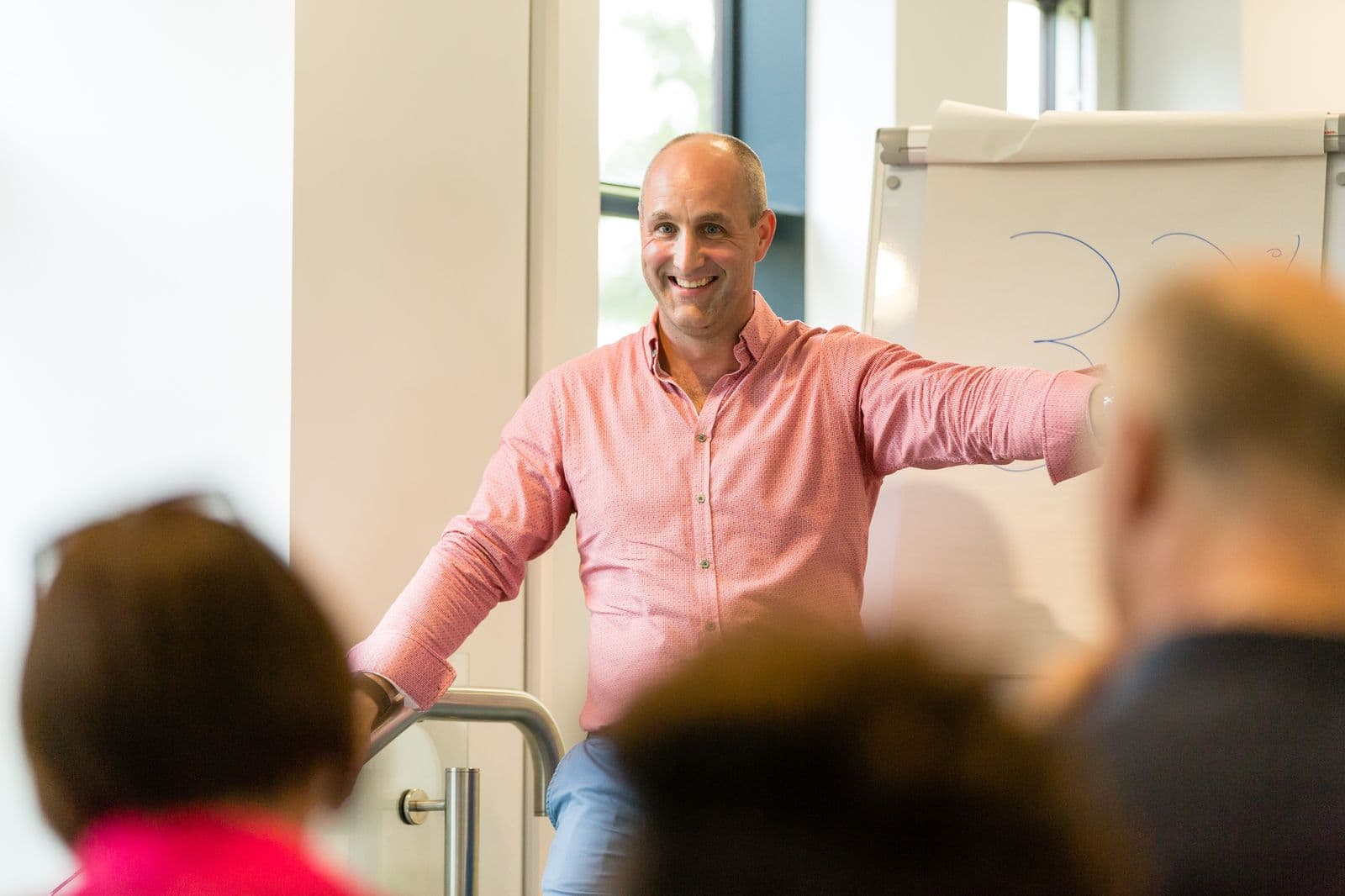 B.D. Dalton speaking at an event with a warm smile